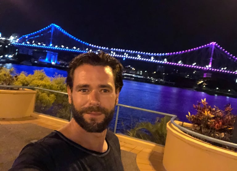 a man taking a selfie with a camera after playing golf in australia