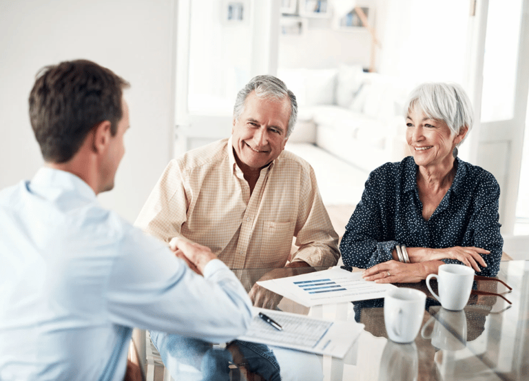 Senior couple meeting with an estate planning advisor to secure their legacy with Guarded Legacy.