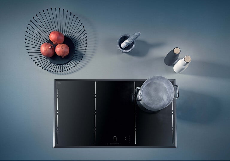 a kitchen with a bowl of apples and a bowl of apples