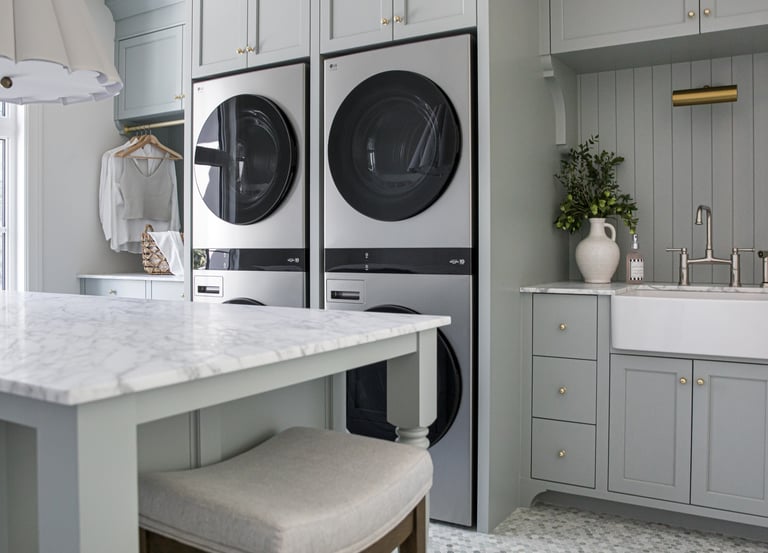 a kitchen with a sink, a sink, and a laundry room