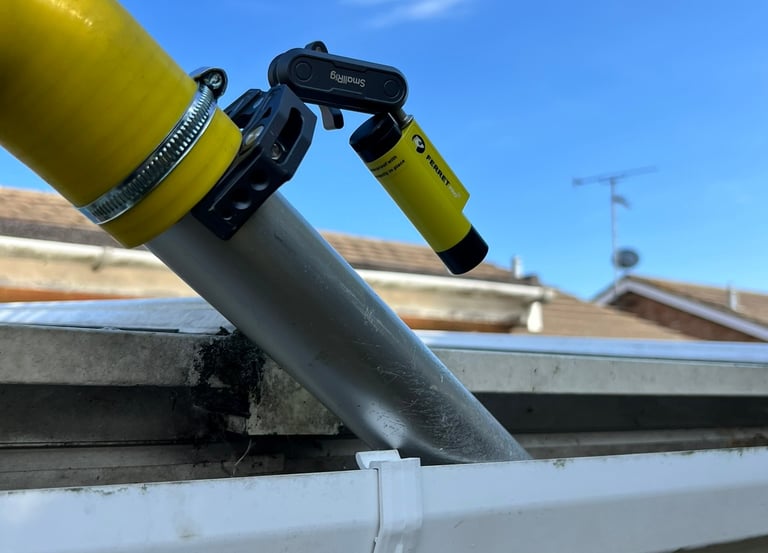 Vac gutter cleaning with an inspection camera