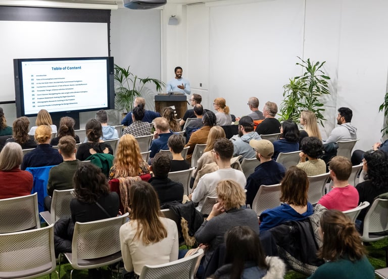 A design professional delivering a talk at a design conference