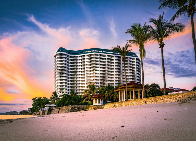 Beachfront resort at sunset with palm trees — UAE hotel deals