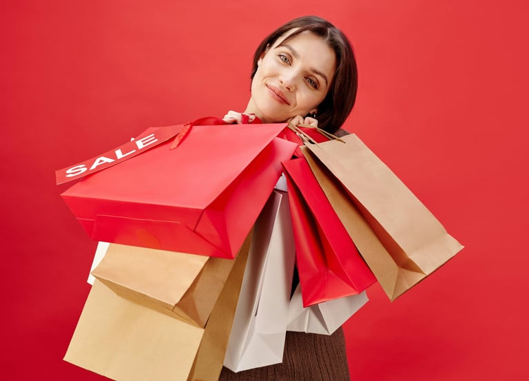 UAE shopping deals — woman carrying sale bags.