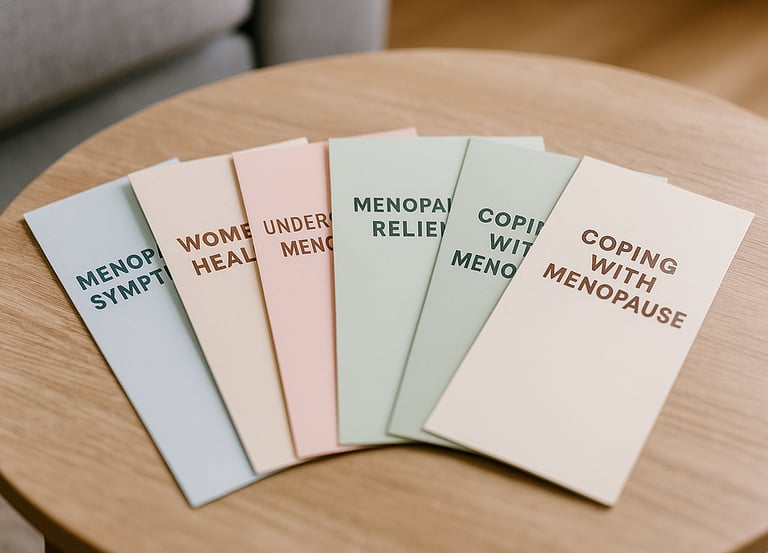 Photograph of several informational leaflets spread out on a coffee table, suggesting health or well