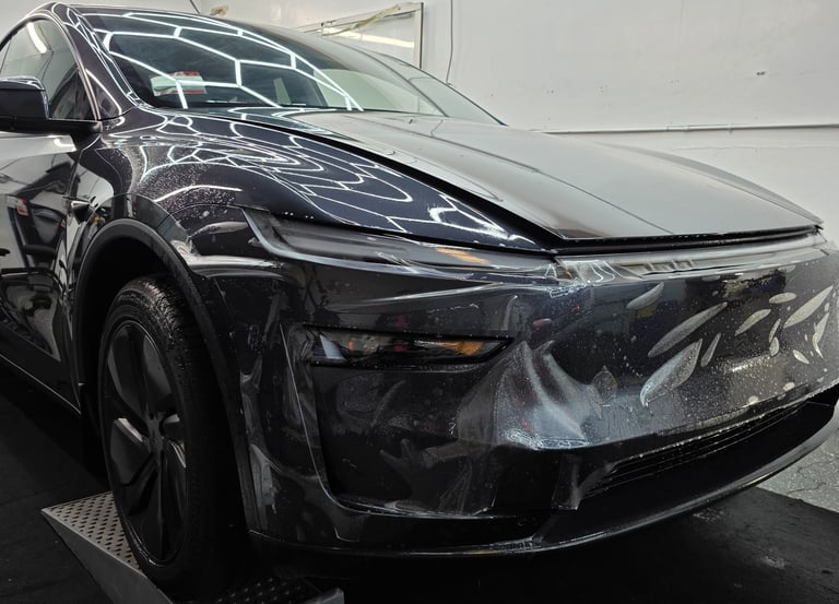 Work-in-progress installation of ppf film on the tesla's front bumper by Bluemax tint in Livermore