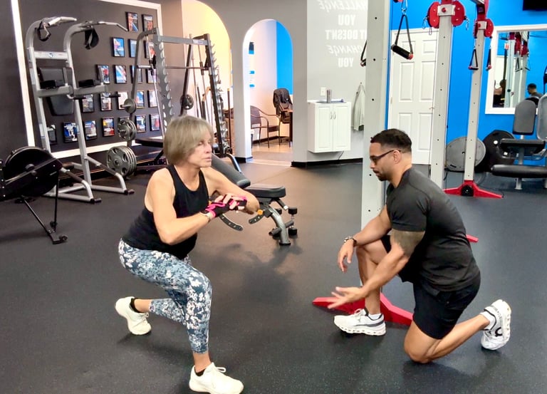fitness coach helping woman how to lunge exercise