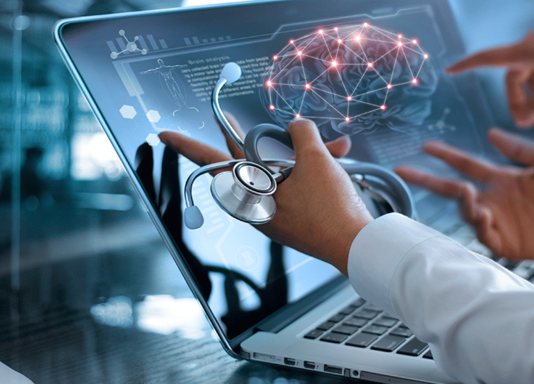 Doctor pointing at a WAVi brain scan on a computer