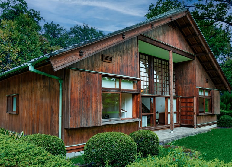 Photo of house with dark wooden trim and a metal roof.