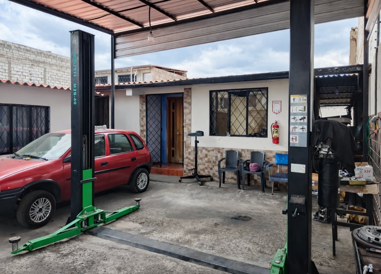Instalaciones equipadas con elevador automotriz y medidas de seguridad para un servicio eficiente.