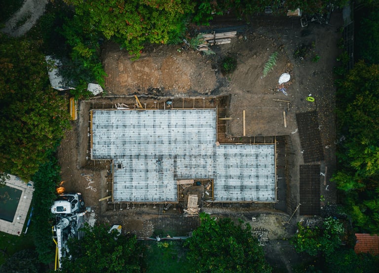 Aerial view of residential concrete foundation under construction in Manitoba