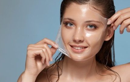 A smiling woman undergoes treatment for radiant facial skin by Dr. Porro.