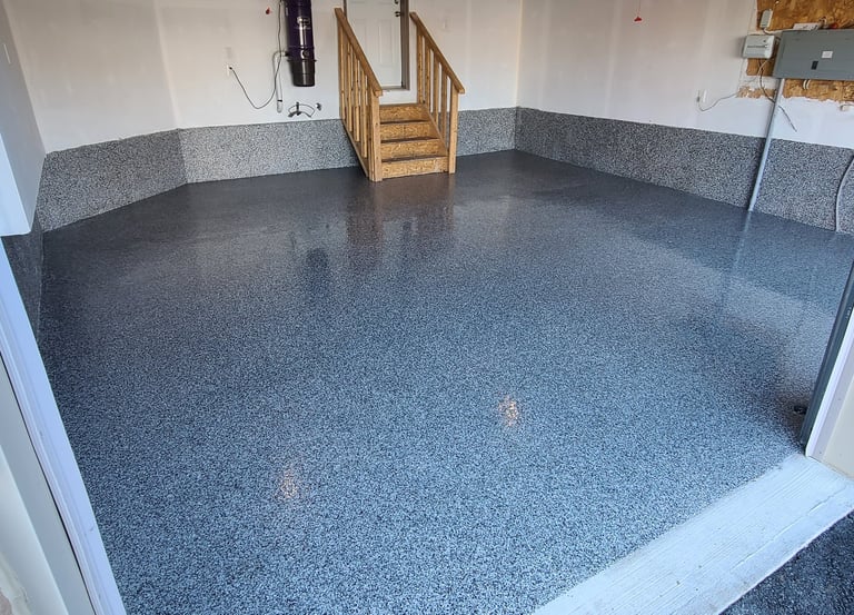 Polyaspartic garage floor with decorative flake finish in residential garage