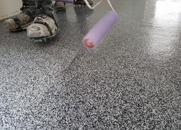 MMA garage flooring installation with decorative flake system and roller application