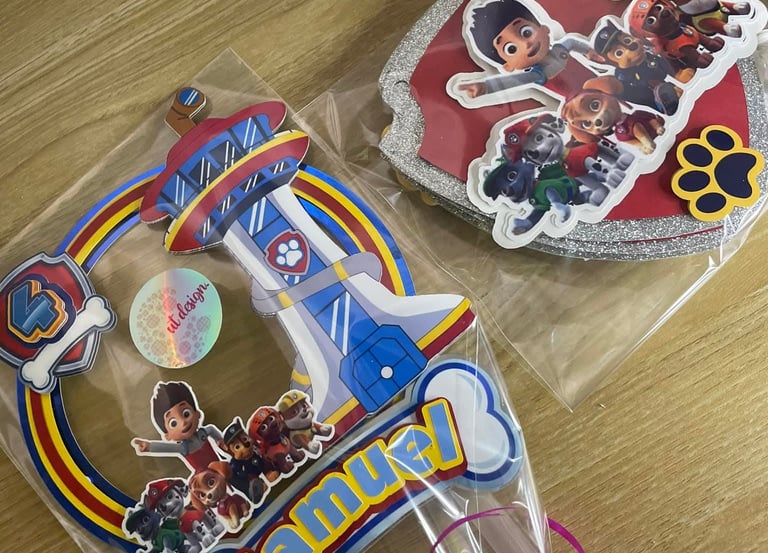 Custom Paw Patrol cake topper and decorations featuring Ryder and pups for a 4th birthday party.