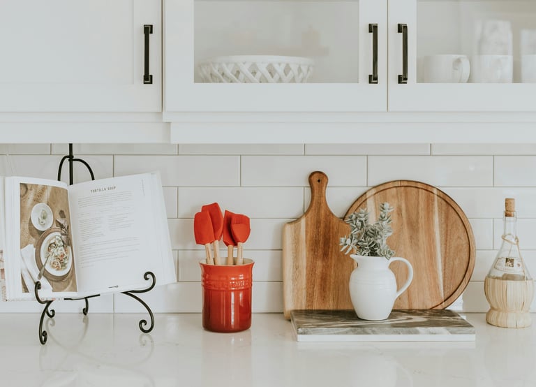 a kitchen counter top with a cutting board and a cutting board