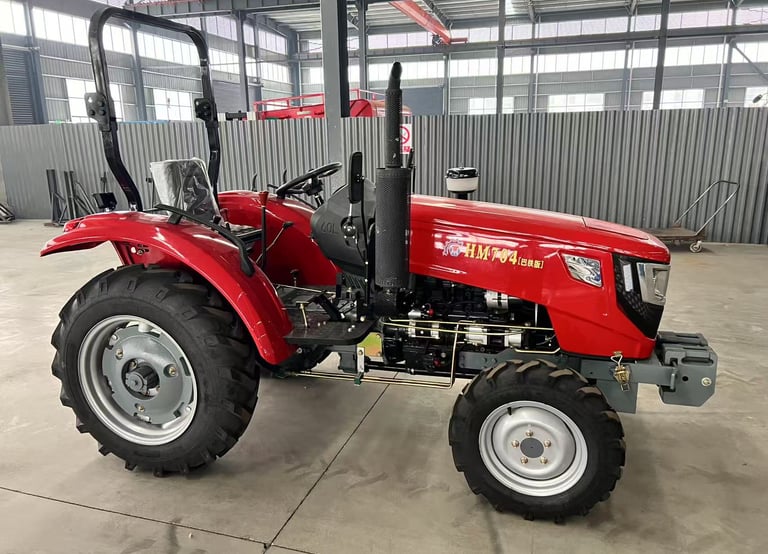 a red tractor with a large wheel on it