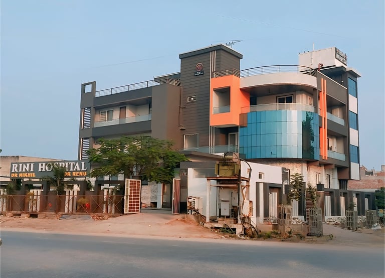 Rini Hospital Dholpur a building with a building in the background