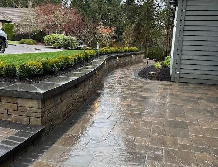 Luxury hardscape design in North York featuring stone retaining walls and interlock patios.