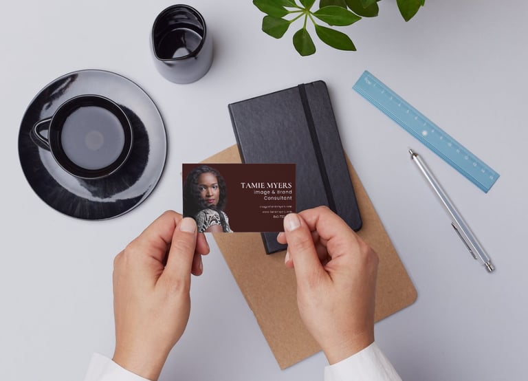 a person holding a business card with a business card