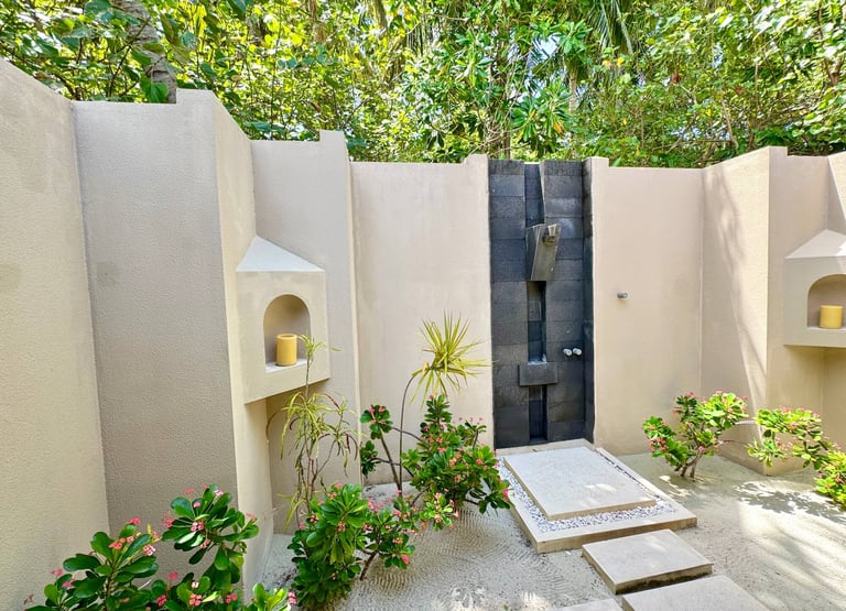 Ayada Maldives sunset beach suite outdoor shower