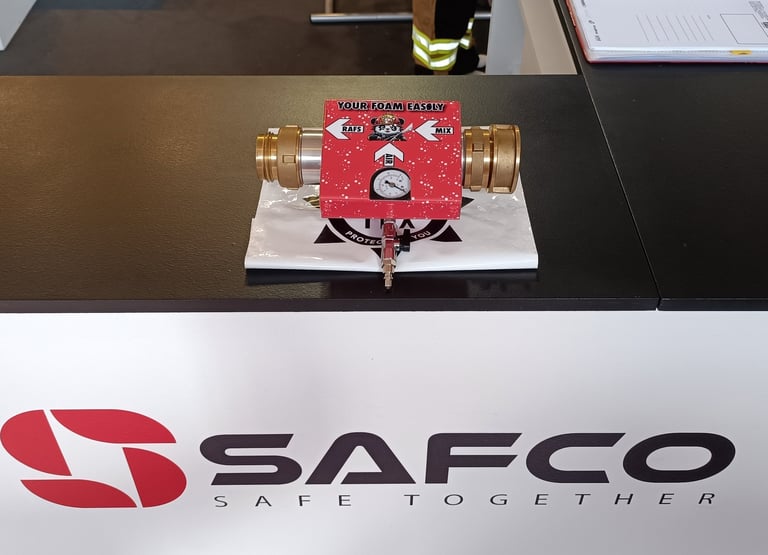 a table with a red fire hydrant and a white sign that says safc