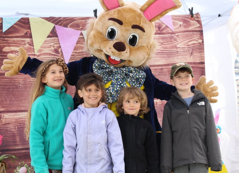 Easter Bunny poses with kids during a meet and greet