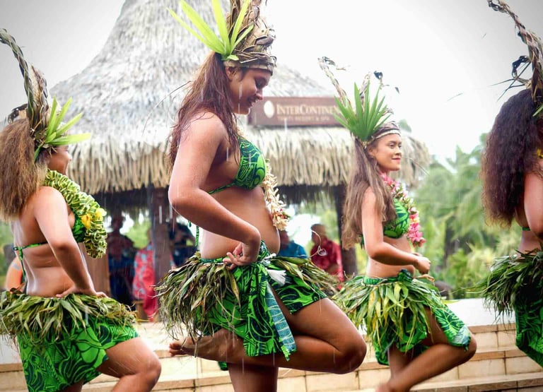 Tahitians dressed in traditional attire during a local dance in Tahiti, French Polynesia.