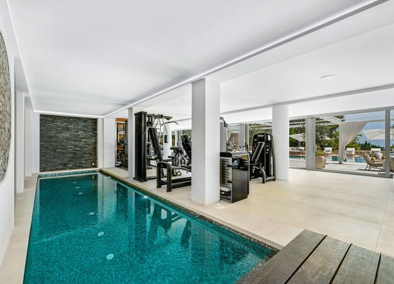 Indoor spa pool and private gym area