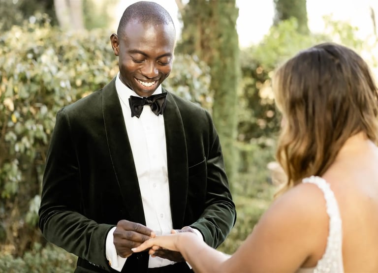 Groom placing the wedding ring on the bride's finger during elopement ceremony in Provence