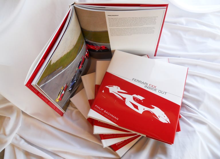 Ferrari FXX Inside Out - Book cover and stack of books