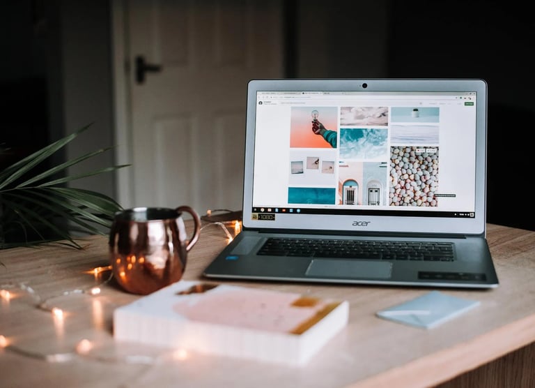 a laptop and a mug on a desk
