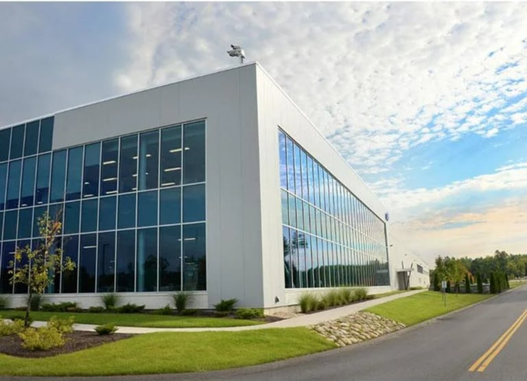 a large building with a lot of windows and a sky view