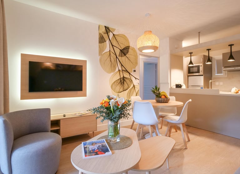 a living room with a table and chairs