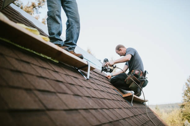 workers installing a brown roof