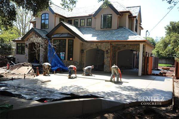 Concrete Driveway Contractors finishing custom driveway