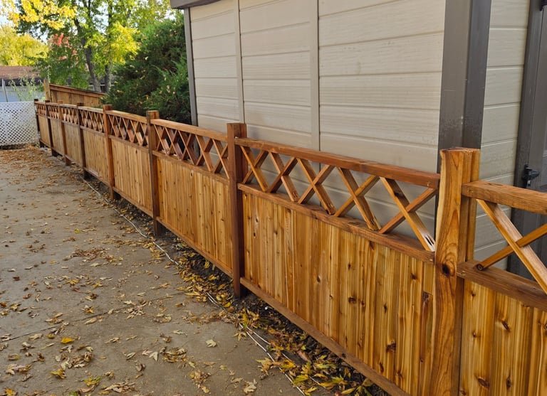 Custom cedar fence with cross-hatched top, design built and installed by Isaac Griffin