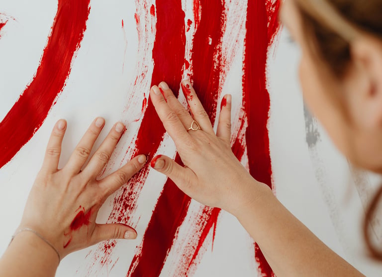 Photo of someone painting with their bare hands during a 1:1 intuitive painting session