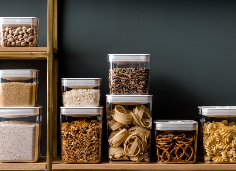Food product photography - a shelf with several containers of food and nuts