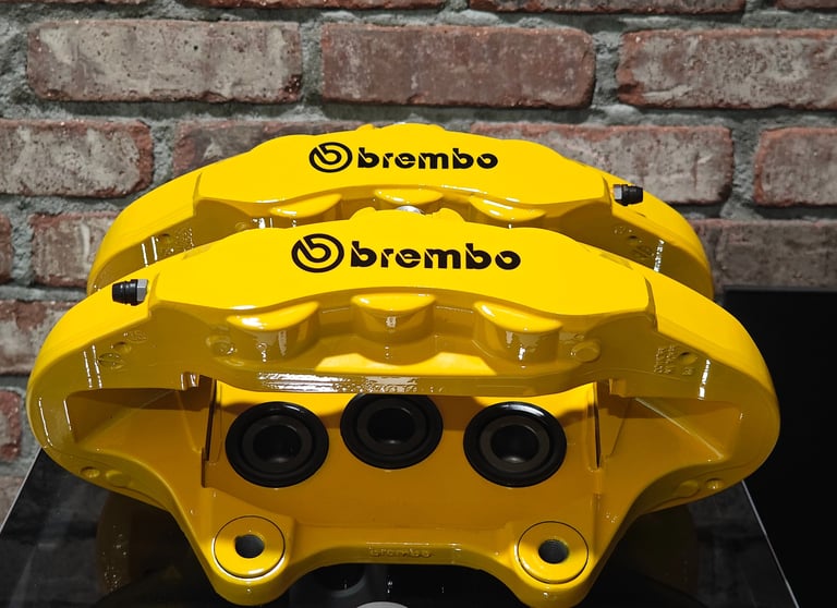 Jeep Trackhawk calipers restored in Signal Yellow powdercoat