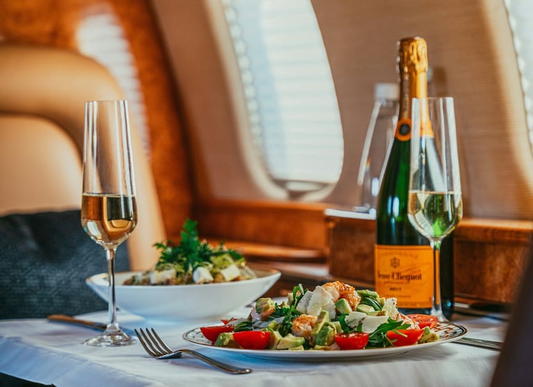 a table with a bottle of champagne and a bottle of wine