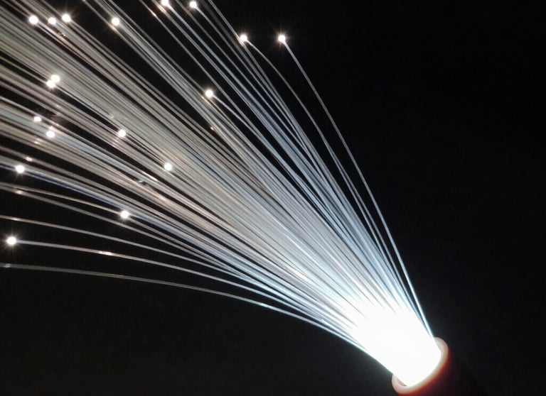 Abstract close-up of a high-speed fiber optic cable glowing with a soft white light in a dark environment. Technical and futuristic Turkish tech vibe.