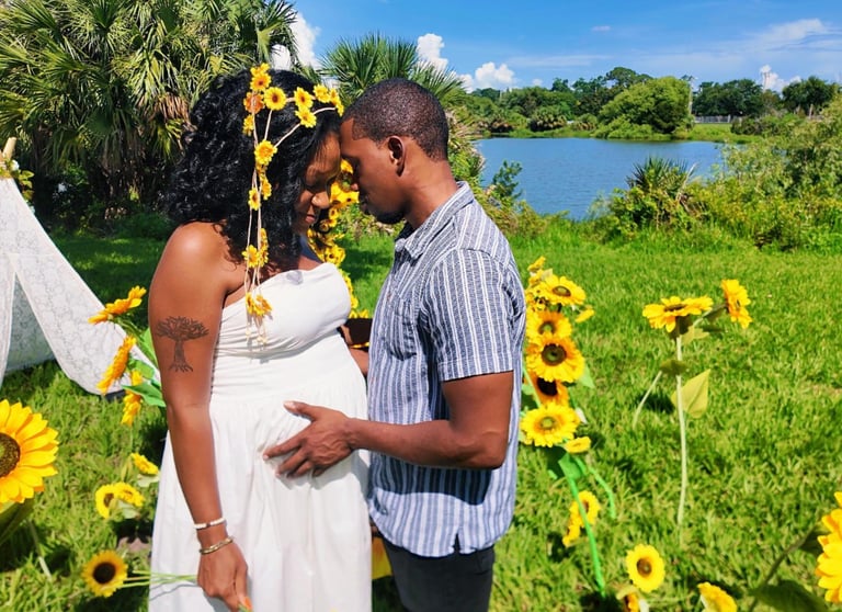 Romantic lakefront marriage proposal setup in Orlando with floral decorations, beautiful sunflowers
