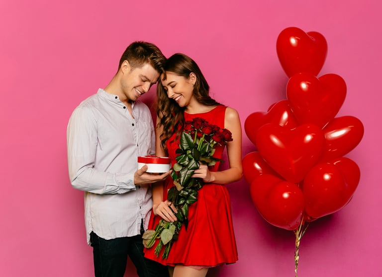 a man and woman holding a gift box