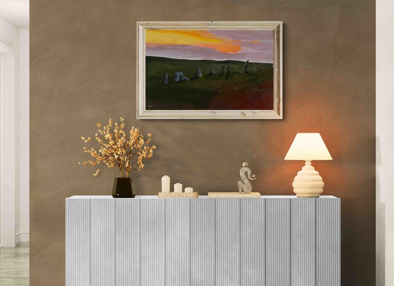 Modern white fluted sideboard featuring a landscape painting and table lamp against a brown wall.
