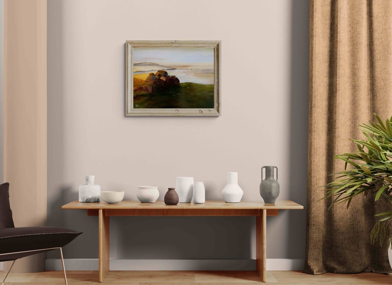 Framed landscape oil painting hanging above a wooden console table with ceramic vases in a modern minimalist room.