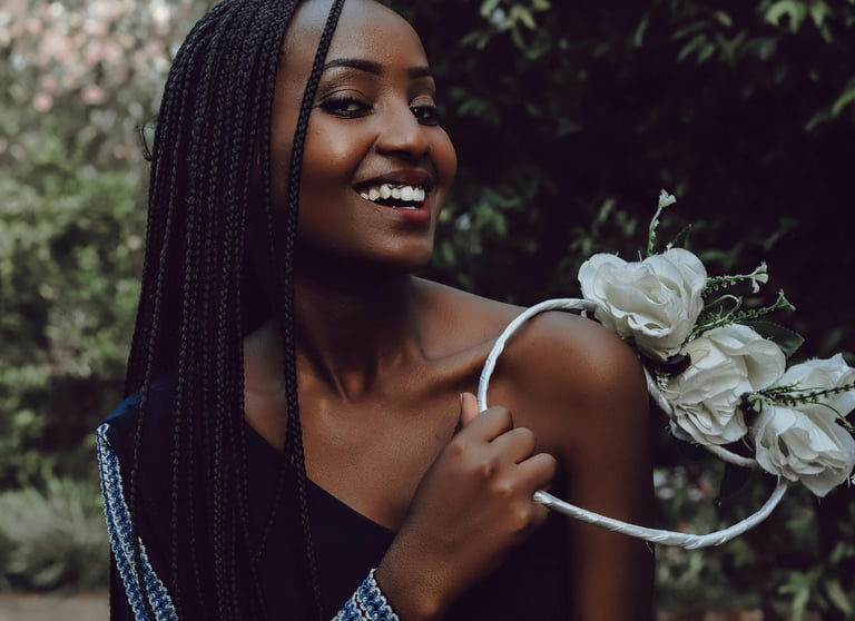 woman holding a ring of flowers