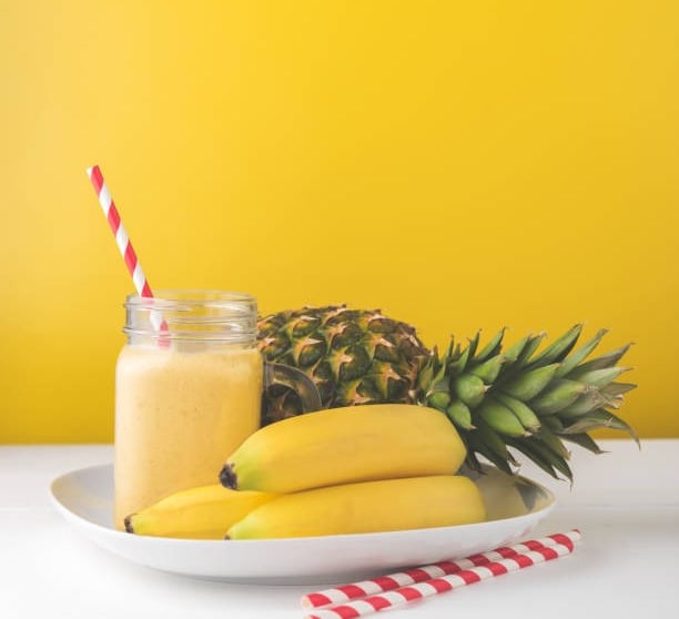 a pineapple smoothie with pineapple and pineapple
