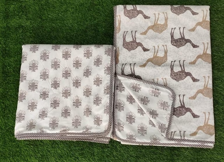 Stack of traditional 3-layer Jaipuri Dohars and reversible cotton AC blankets for bulk wholesale