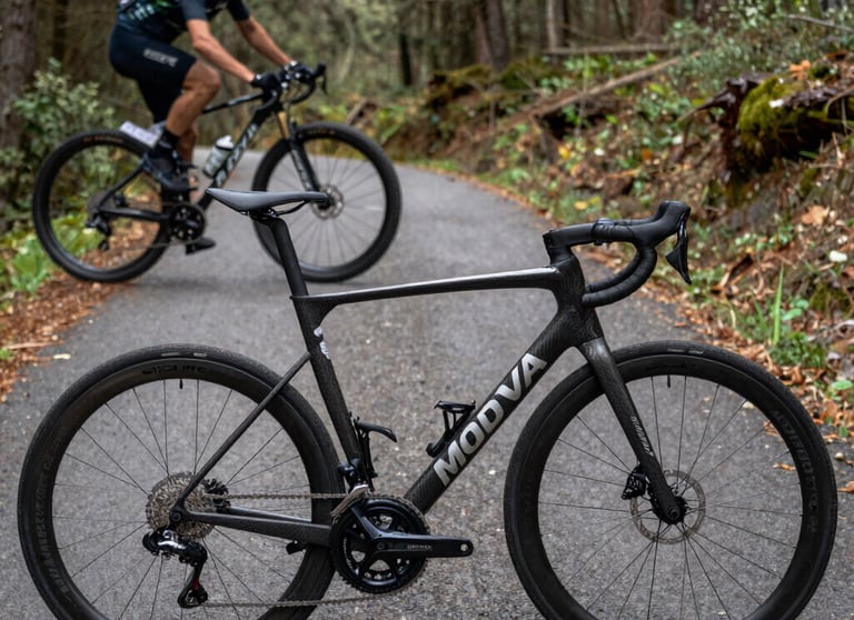 A dynamic split composite image showing a professional carbon road bike on asphalt and a mountain bike deep in forest terrain, highlighting the key cycling disciplines in Moldova.